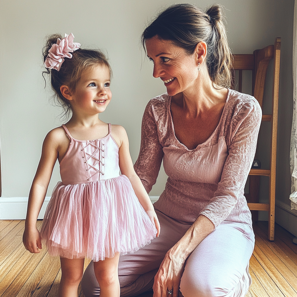 A woman kneeling in front of her daughter | Source: Midjourney