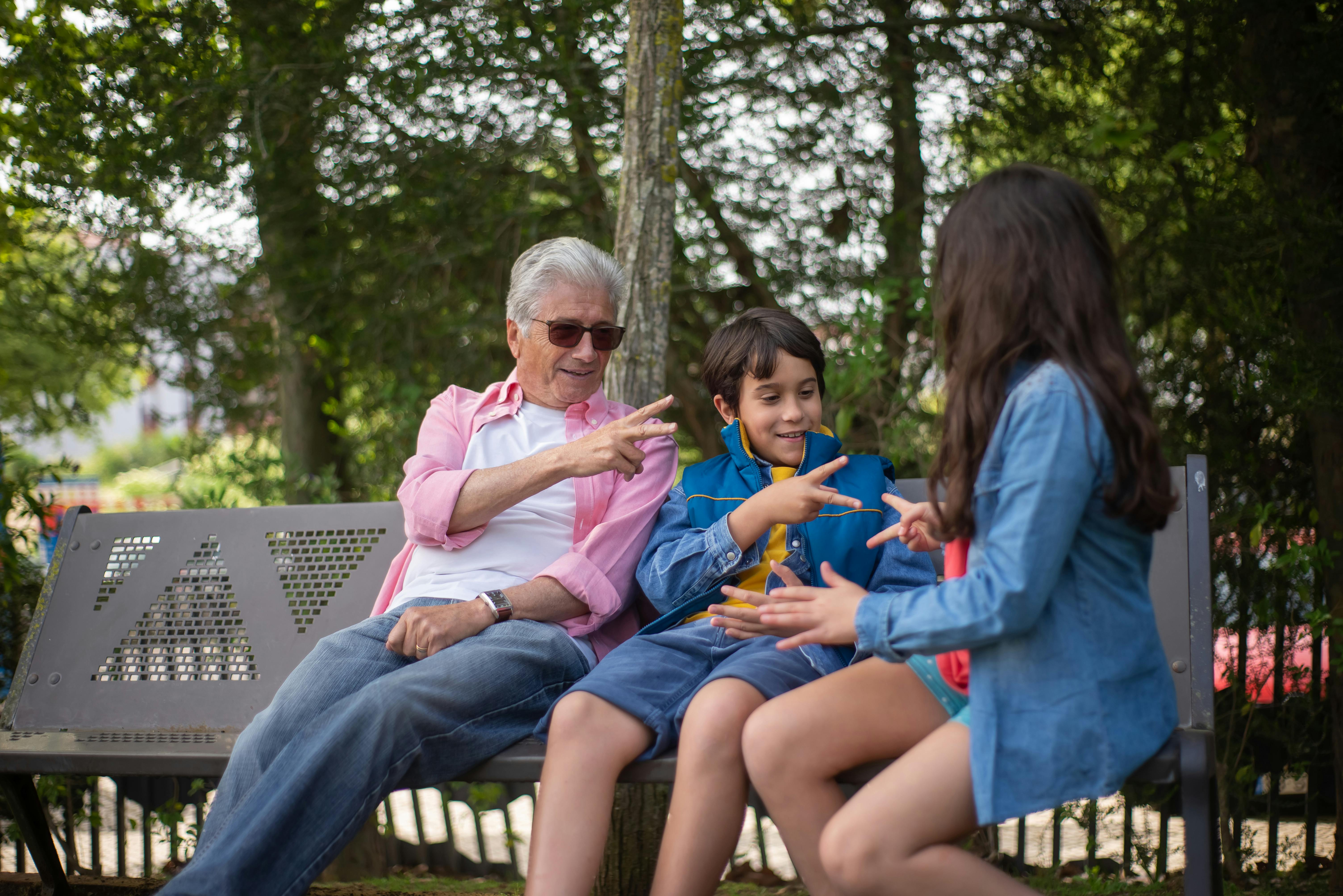 Grandfather bonding with his grandchildren | Source: Pexels