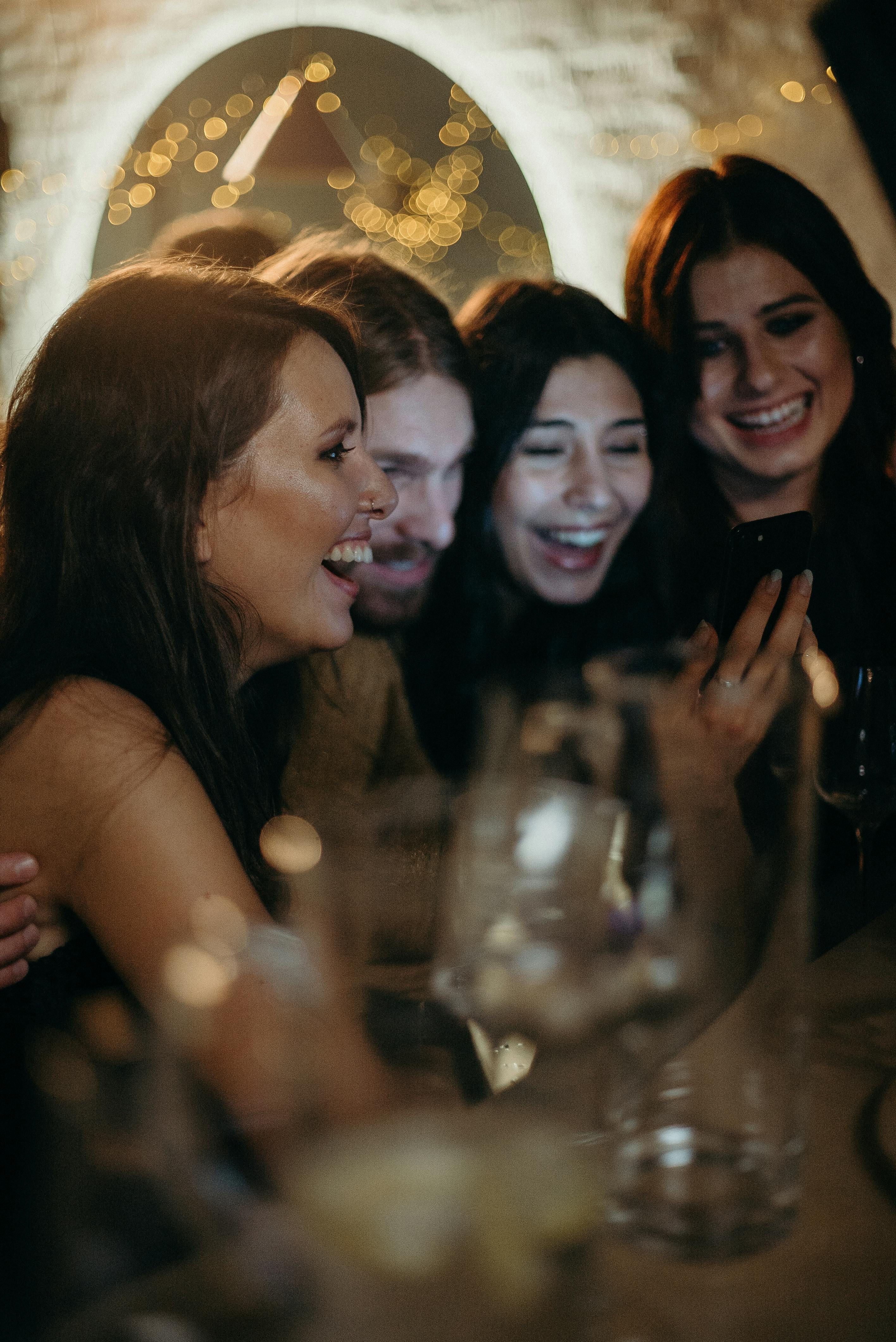 Guests gathering in the kitchen | Source: Pexels