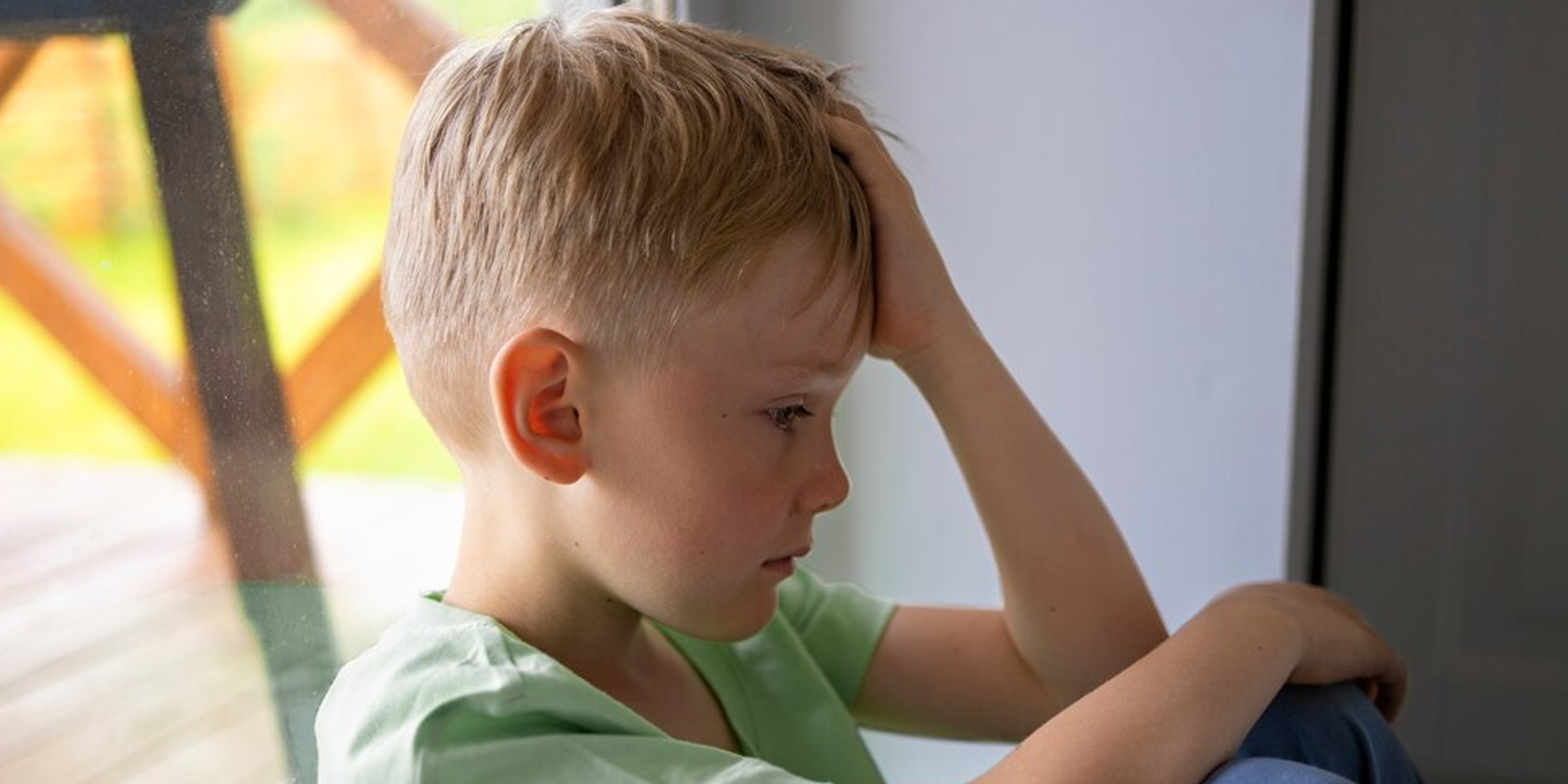 A thoughtful young boy | Source: Freepik