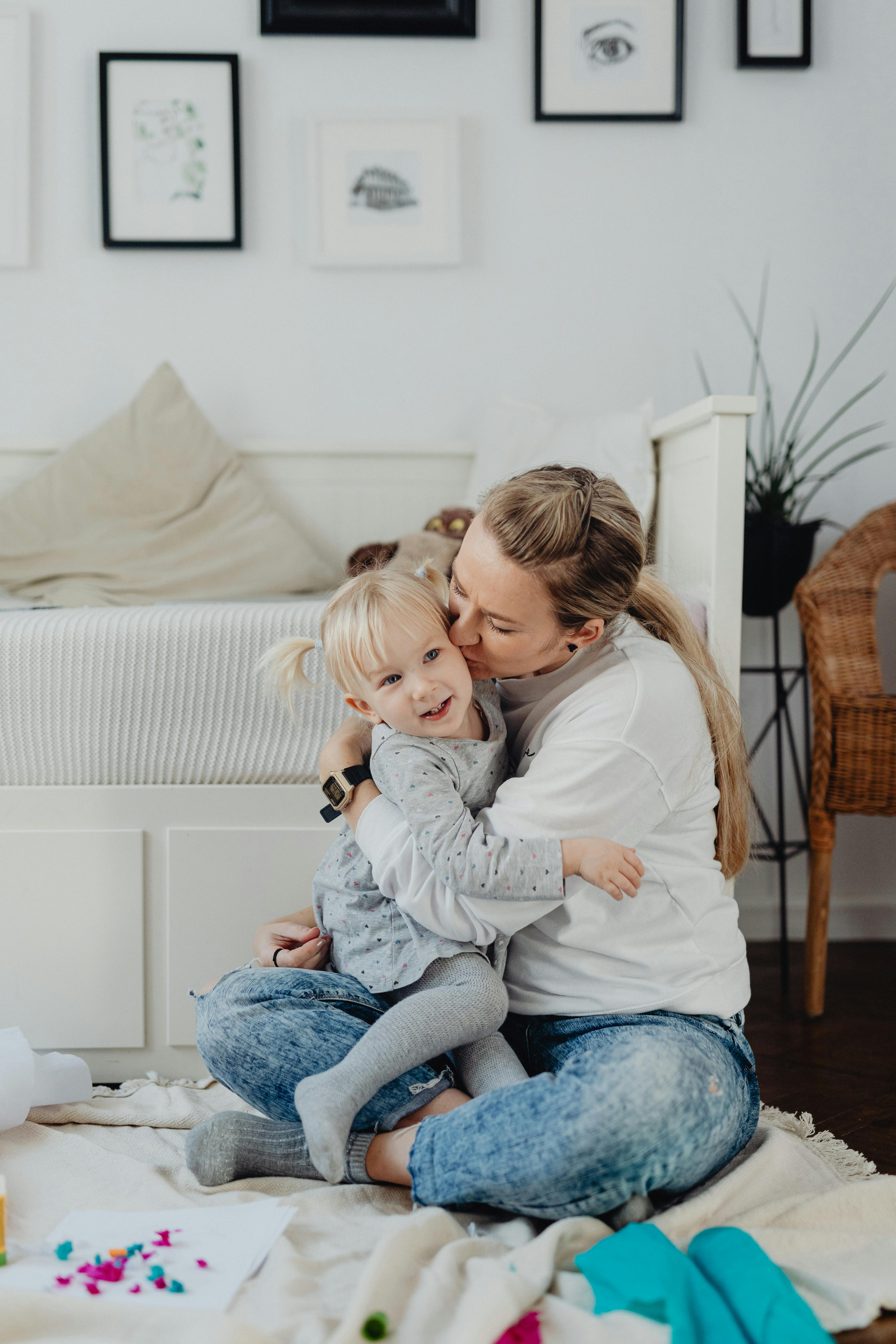 A mother hugging her daughter | Source: Pexels