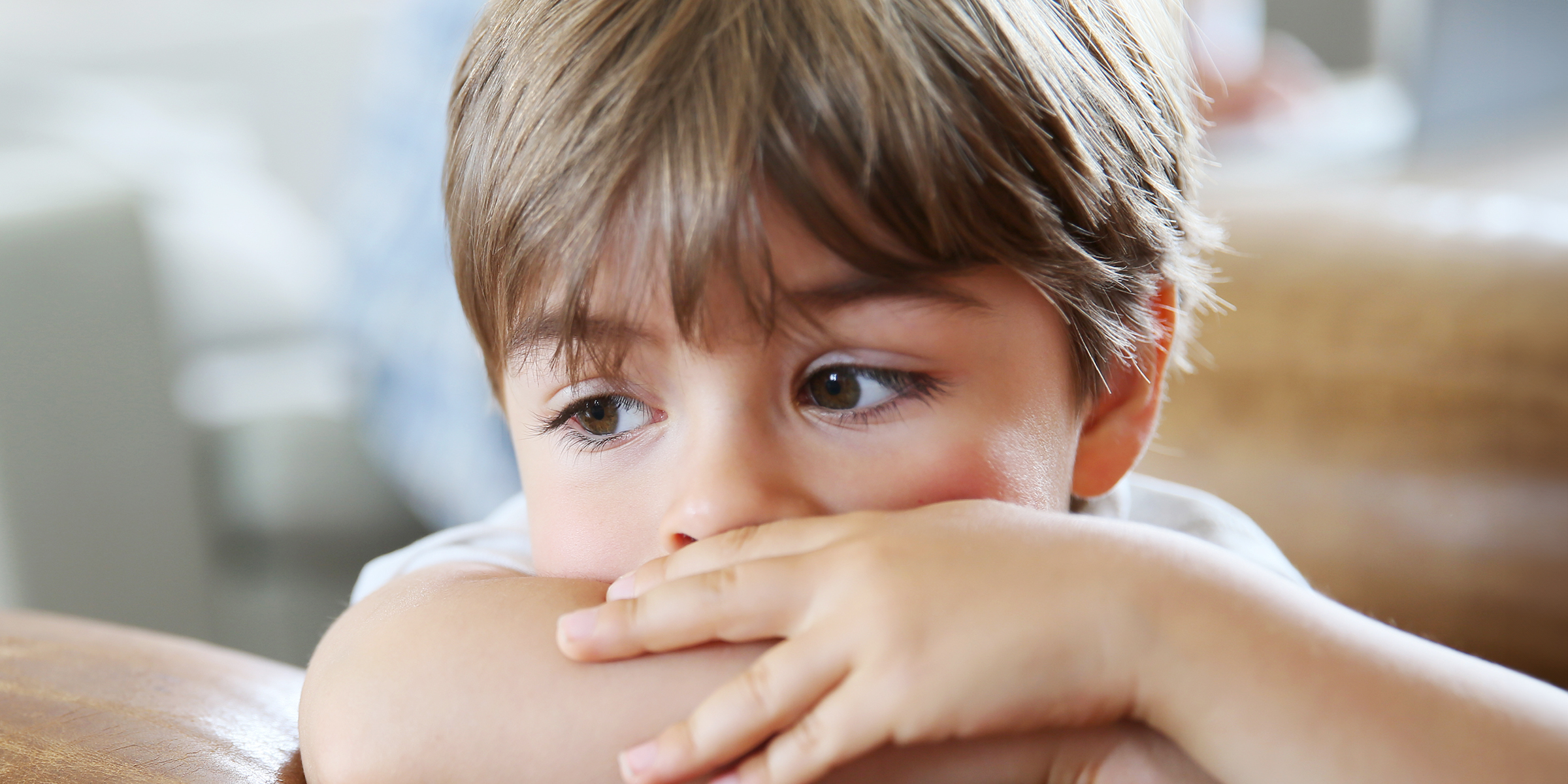 A little boy with folded arms | Source: Shutterstock