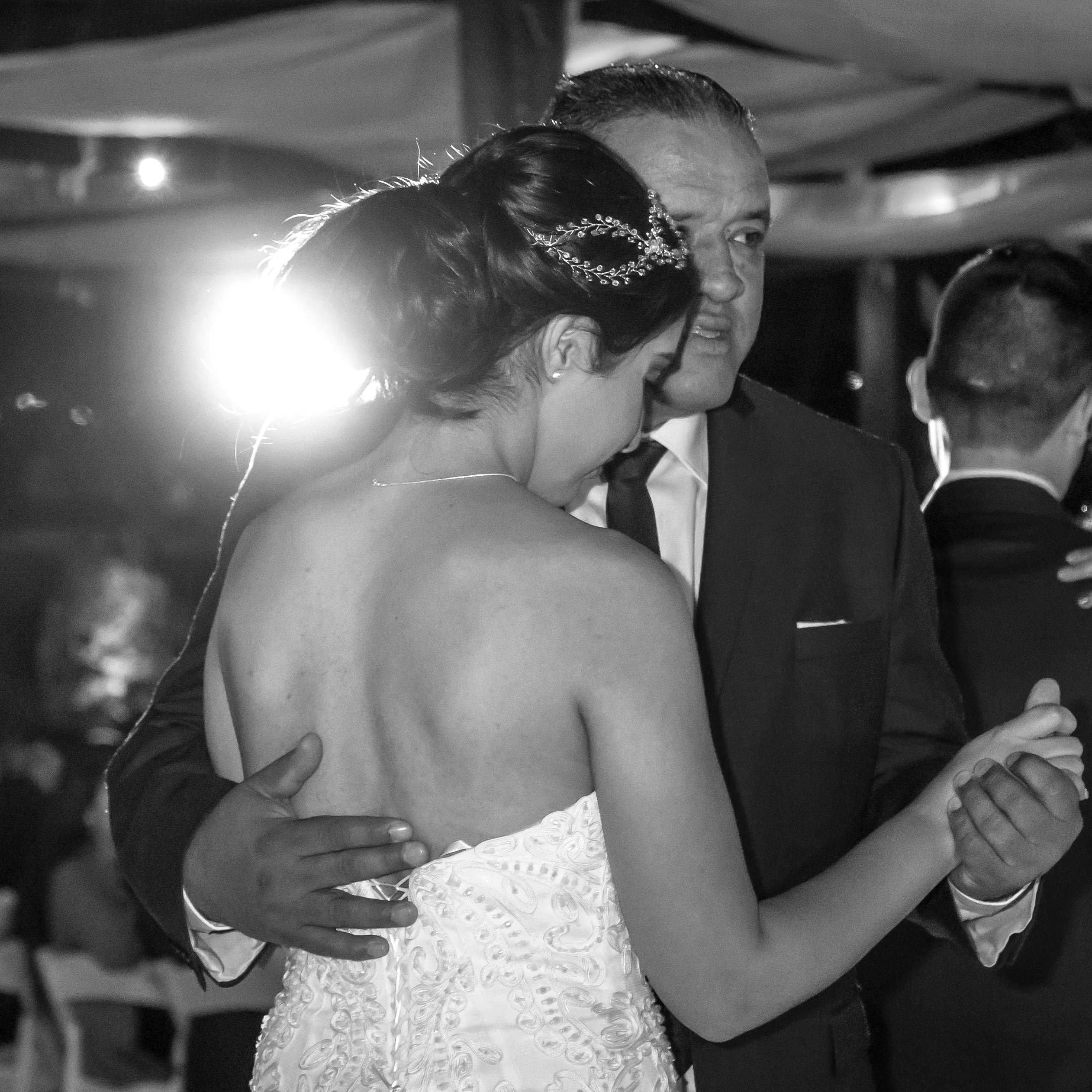 A bride dancing with an elderly man at a wedding reception | Source: Pexels