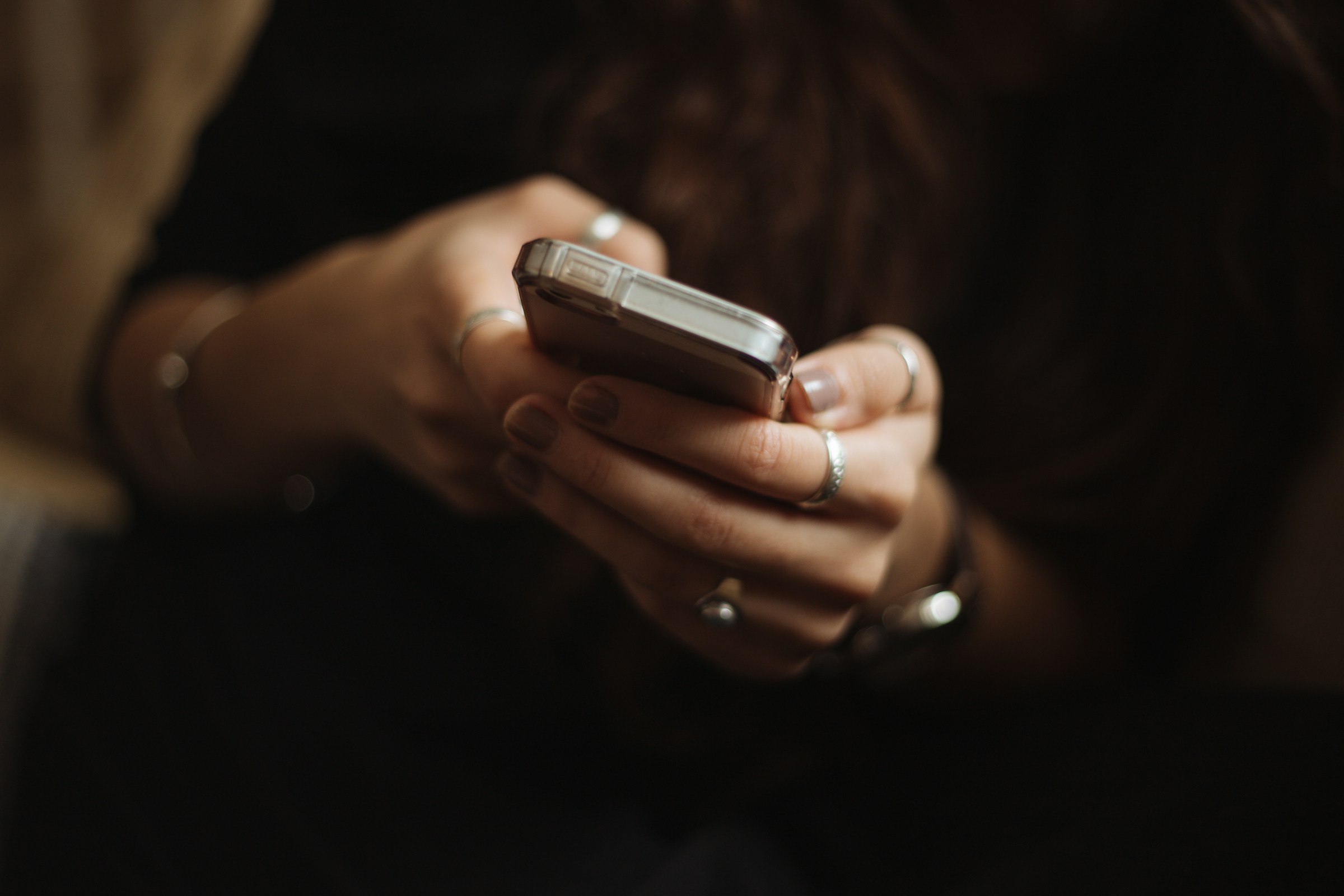 A woman holding a phone | Source: Unsplash