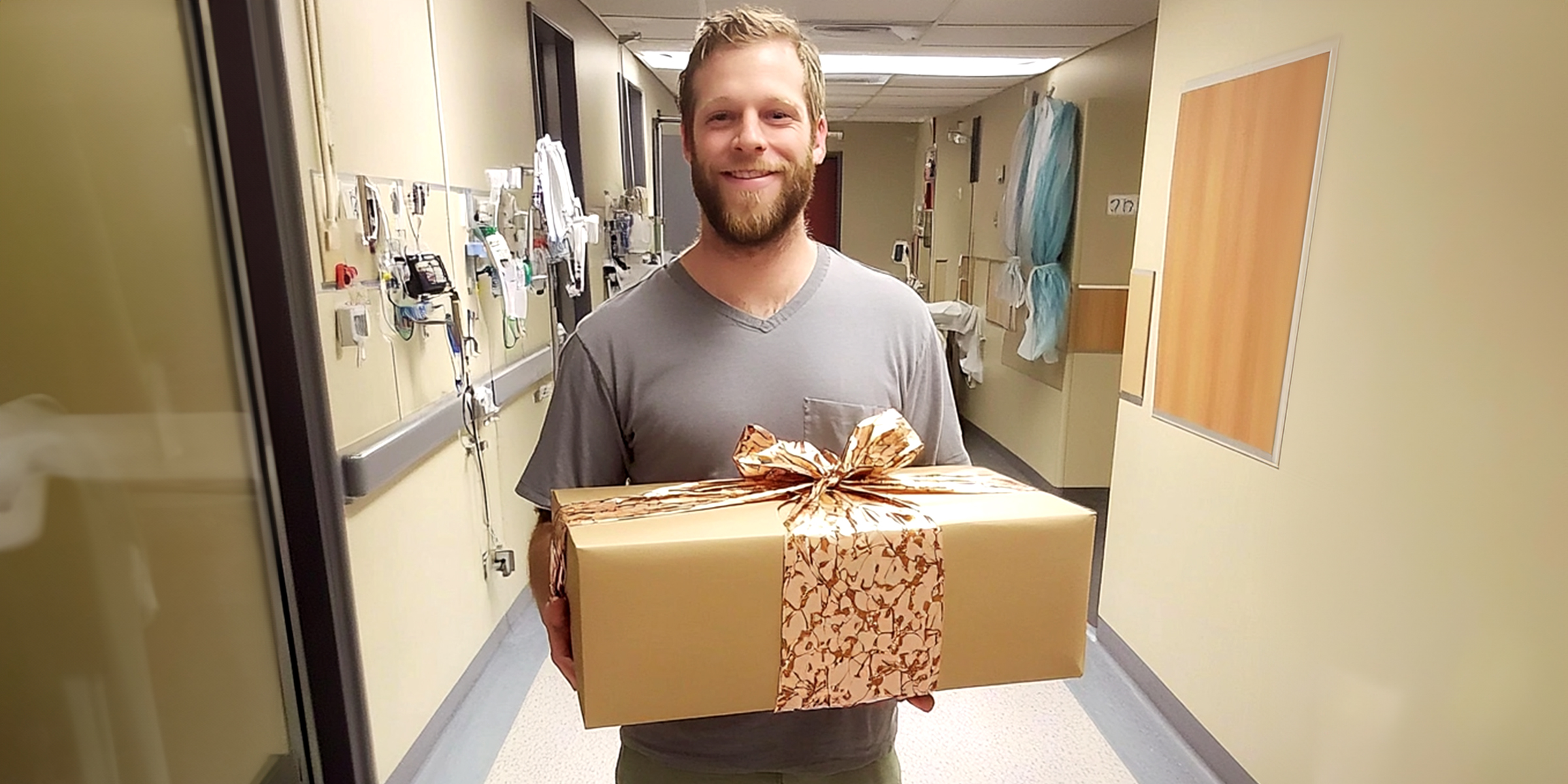 A man standing in a hospital holding a gift | Source: Amomama